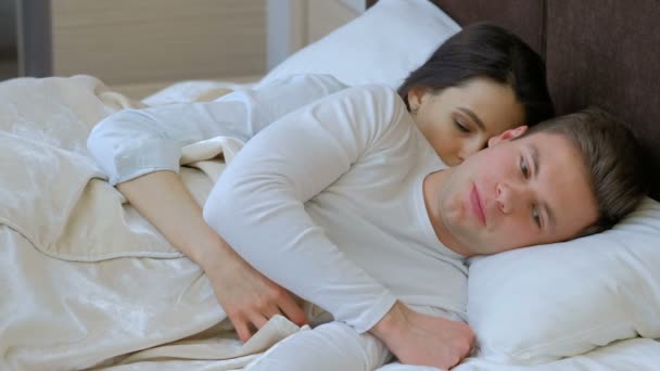 couple intimate problems man woman lie bed hugging - Video, Çekim