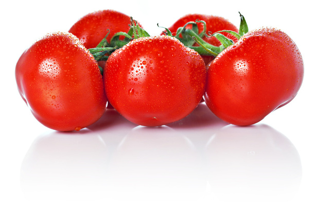 Closeup of vine tomatoes isolated on white - 写真・画像