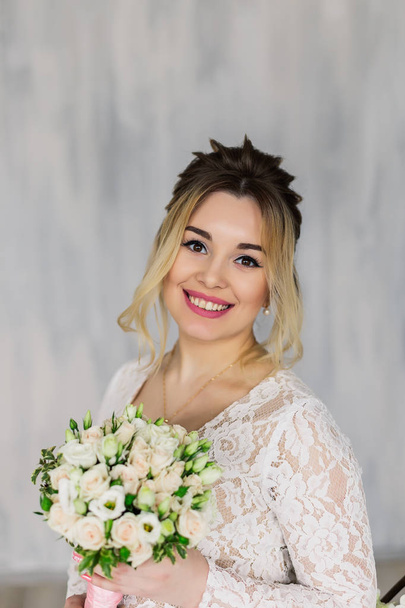 Beautiful woman in wedding dress in photo studio. - Fotó, kép