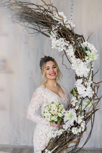 Beautiful woman in wedding dress in photo studio. - Valokuva, kuva