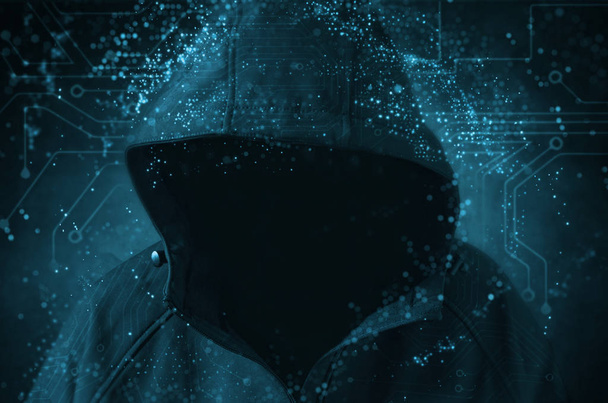 Unrecognizable hooded hacker hacking artificial neural network. Cybersecurity concept. - Photo, Image