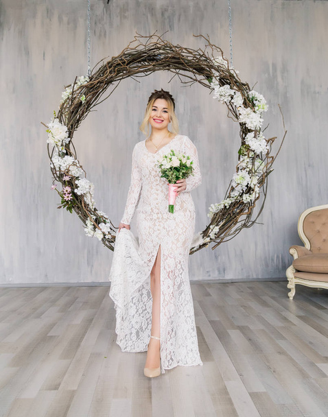 Beautiful woman in wedding dress in photo studio. - Photo, Image