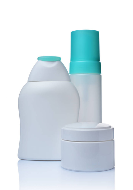 Blank white mockup jar, dispenser and figured bottles of cosmetic products - Fotografie, Obrázek