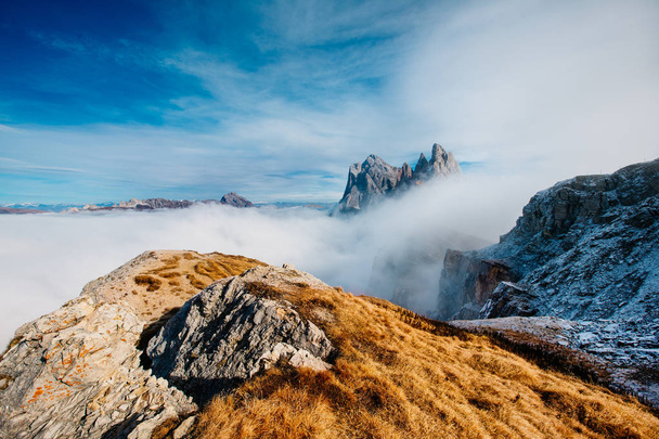 View from Seceda, Odle mountains in the fog, over the clouds. Amazing unique views in Dolomites mountains, Italy, Europe. - Valokuva, kuva