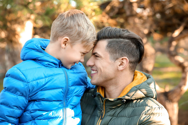 Young man and little boy outdoors  - Photo, Image