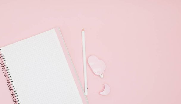 Notebook, white sheet, pencil, proofreader. Pink background.Instagram concept - Photo, image
