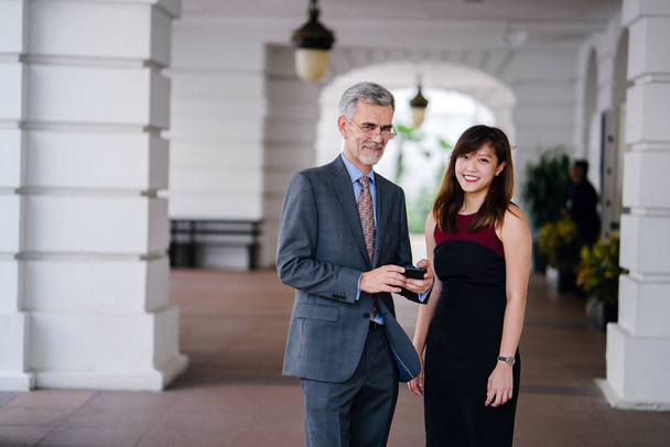 Business man and woman with smartphone, business concept - Photo, image