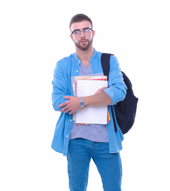 A male student with a school bag holding books isolated on white background. Education opportunities. College student. - Fotografie, Obrázek