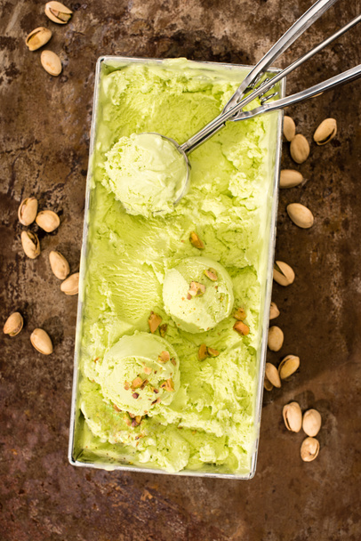 elevated view of pistachio ice cream with scoop on table - 写真・画像