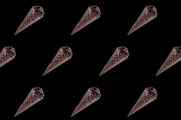 top view of pattern of chocolate black ice cream isolated on black - Photo, image