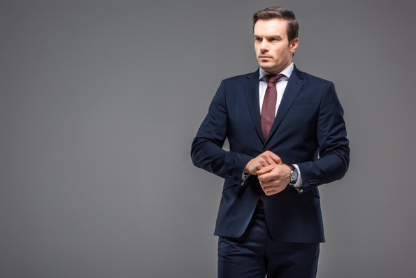 handsome businessman in formal wear, isolated on grey - Photo, Image