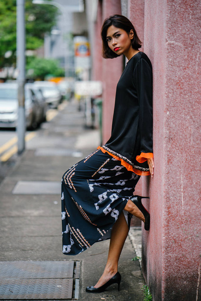 Fashion portrait of a beautiful, asian fashionable woman  posing on the street - Valokuva, kuva