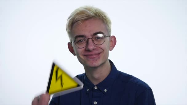 young man holding signs danger on a white background - Felvétel, videó