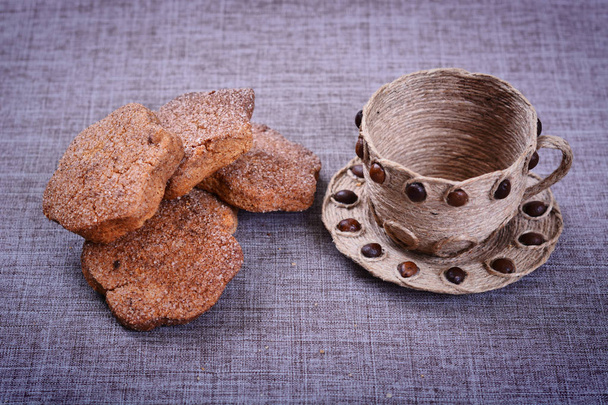 Sweet biscuits lying next to the decorative Cup - Foto, Bild