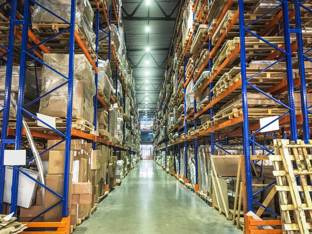 Warehouse or hangar storage racks or shelves with boxes and goods. Industrial logistic delivery and distribution - Φωτογραφία, εικόνα