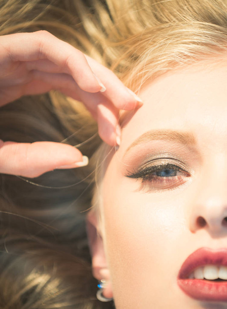 Sensual girl half face with makeup and blond hair - Foto, imagen