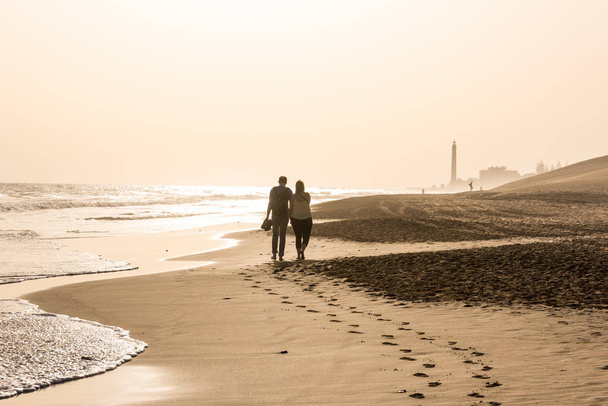 Couple walking together at beach - Fotoğraf, Görsel