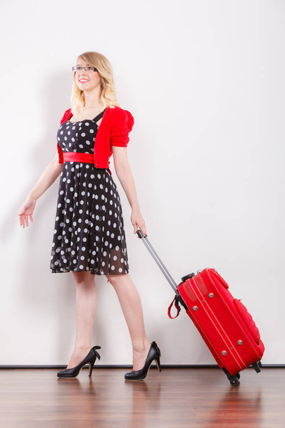 Elegant fashion woman with red suitcase - Фото, зображення