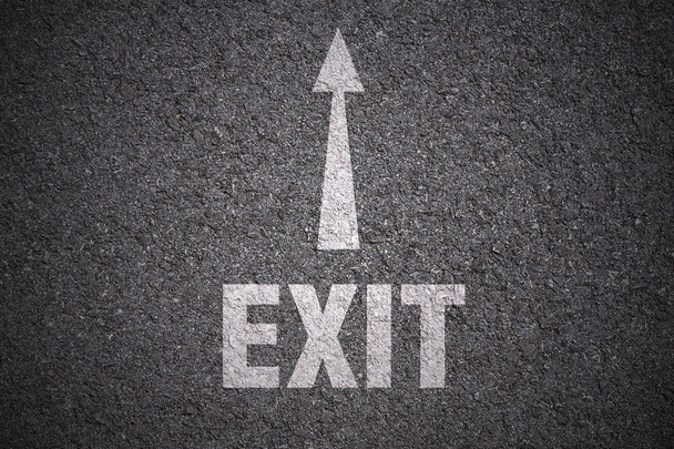 white arrow and exit lettering on asphalt background - Photo, Image