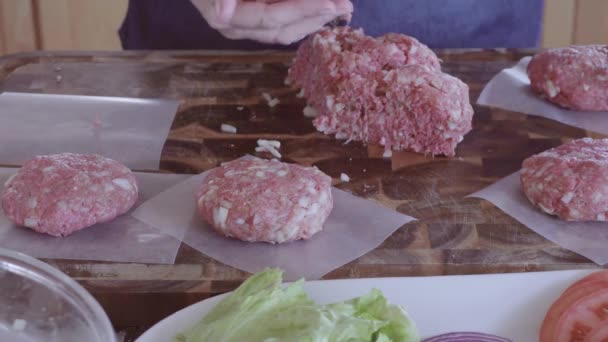 Preparing gourmet burger patties with ground beef - Кадры, видео