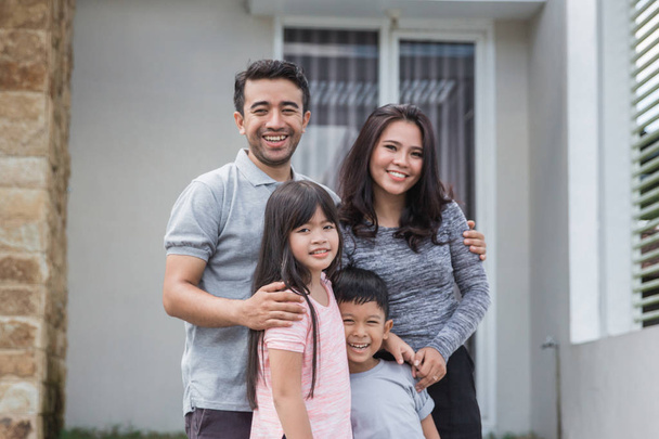 happy asian family in front of their house - 写真・画像