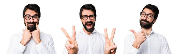 Handsome man with glasses making victory gesture - Фото, зображення
