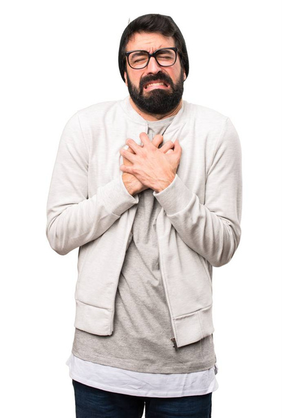 Hipster man with heart pain on white background - Photo, image