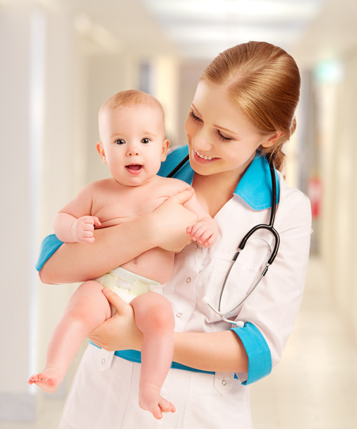 Pediatrician woman doctor holding baby - Photo, Image