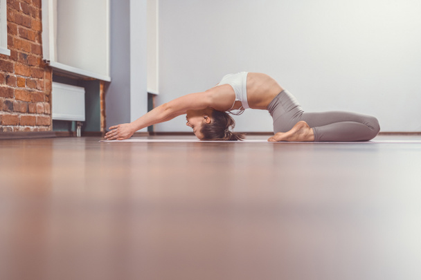 Young woman practicing yoga - Photo, Image