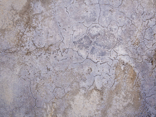Praskliny a skvrny na povrchu betonové zdi - Fotografie, Obrázek
