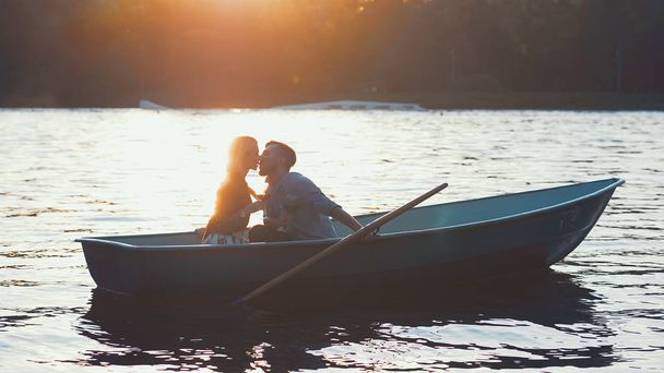 Kissing couple in a boat - Photo, Image