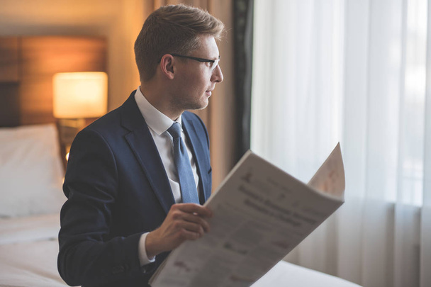 Young businessman with a newspaper - Photo, Image