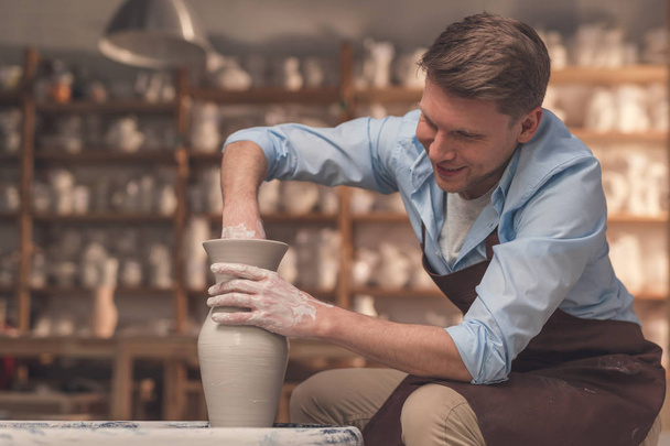 Young man at the potter's wheel - Photo, Image