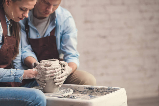Young couple at the potter's wheel - Photo, Image