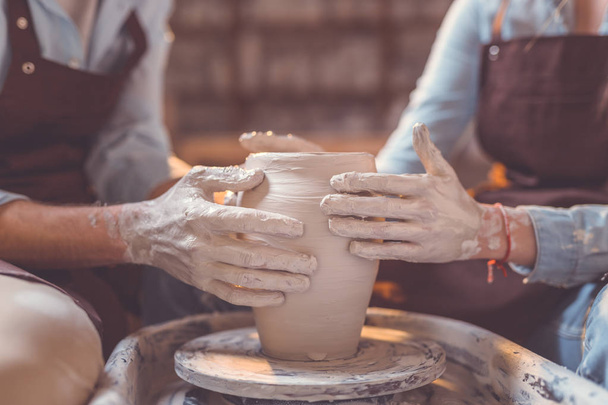 Young couple in pottery closeup - Photo, Image