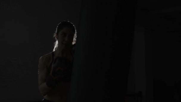 Female boxer training at the boxing club - Video, Çekim