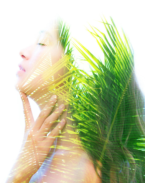 Double exposure of bright aspects of nature highlighted along female face with peaceful and relaxed expression - Foto, Bild