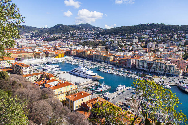 NICE, FRANCE, on March 9, 2018. Yachts in old city port and the embankment. View from a survey site of Hill Shato - Zdjęcie, obraz
