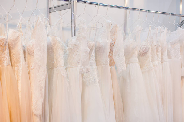 Rack with a lot of chic wedding dresses. - Photo, image