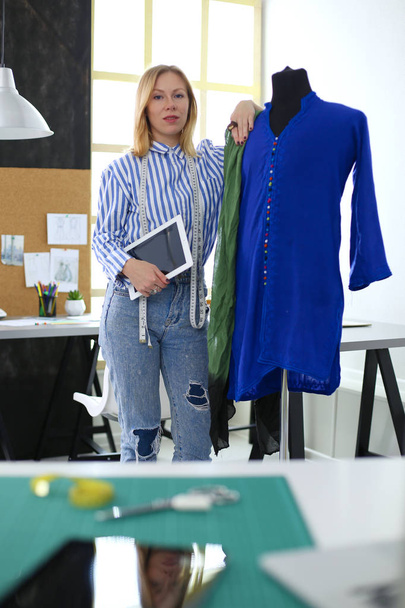 Fashion designer working on her designs in the studio - Fotoğraf, Görsel