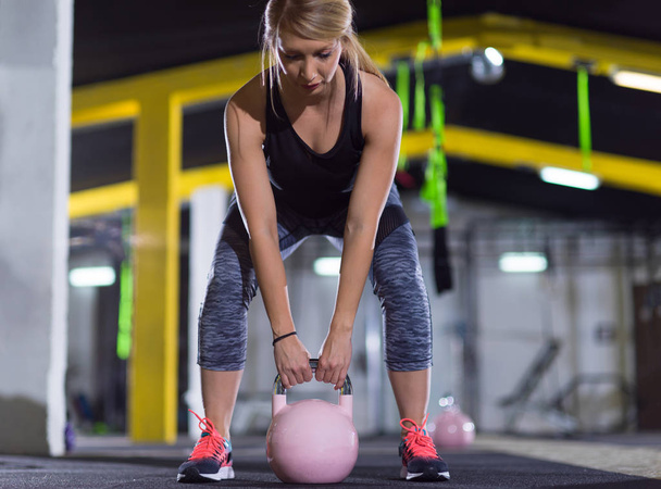 woman exercise with fitness kettlebell - Foto, immagini