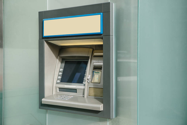 Modern street ATM machine for withdrawal of money and other financial transactions - Photo, Image