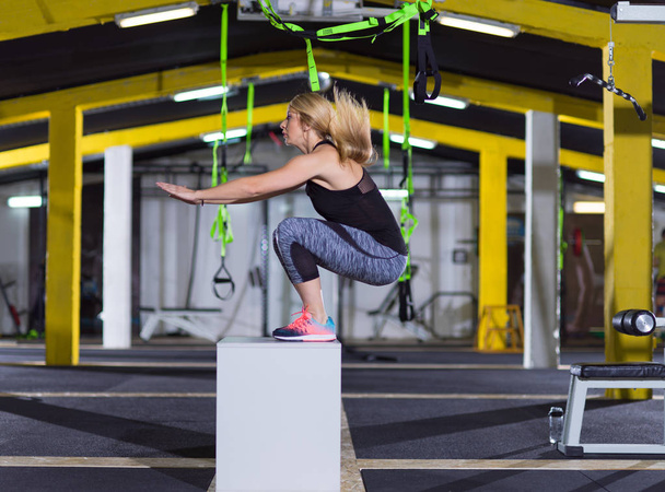 woman working out  jumping on fit box - Foto, imagen