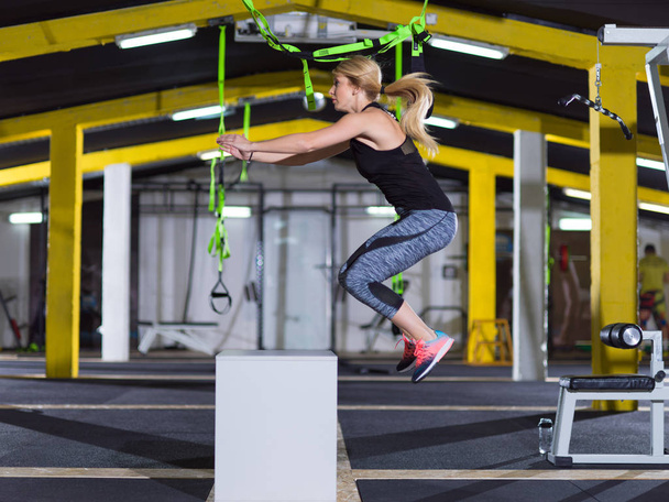 woman working out  jumping on fit box - Zdjęcie, obraz