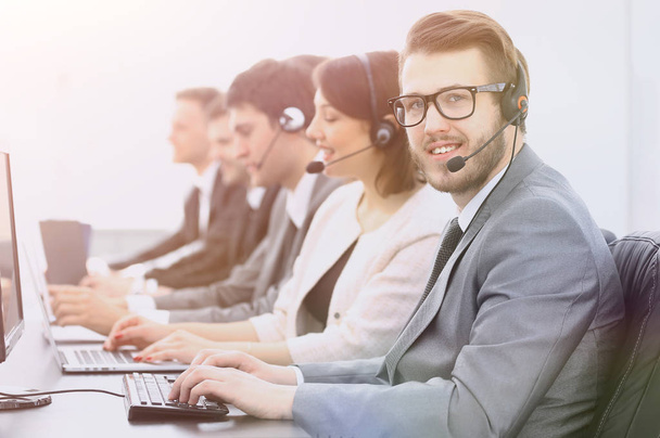 operator call center with colleagues sitting at the workplace - Foto, Imagem