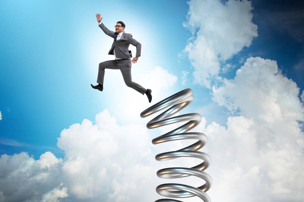 Businessman jumping from spring in promotion concept - Photo, Image