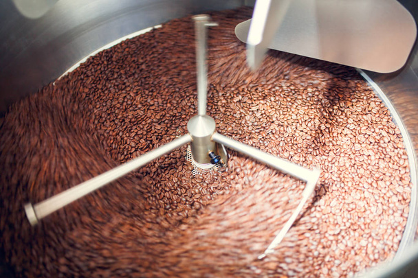 Photo of coffee beans in industrial roaster - 写真・画像