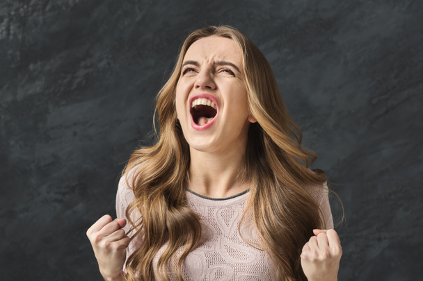 Portrait of angry woman shouting - 写真・画像