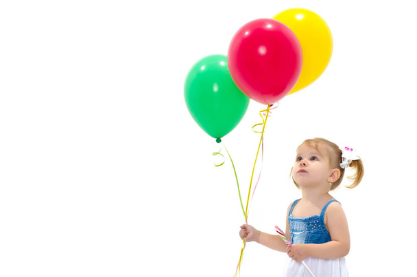 Little girl is playing with a balloon - Photo, Image