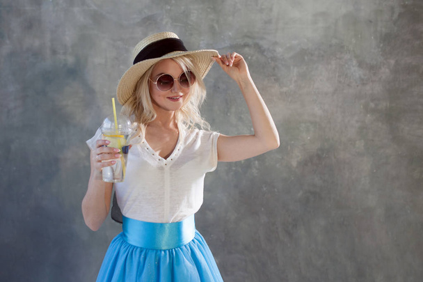 Young beautiful blonde woman in straw hat. Summer style sunglasses. - Zdjęcie, obraz